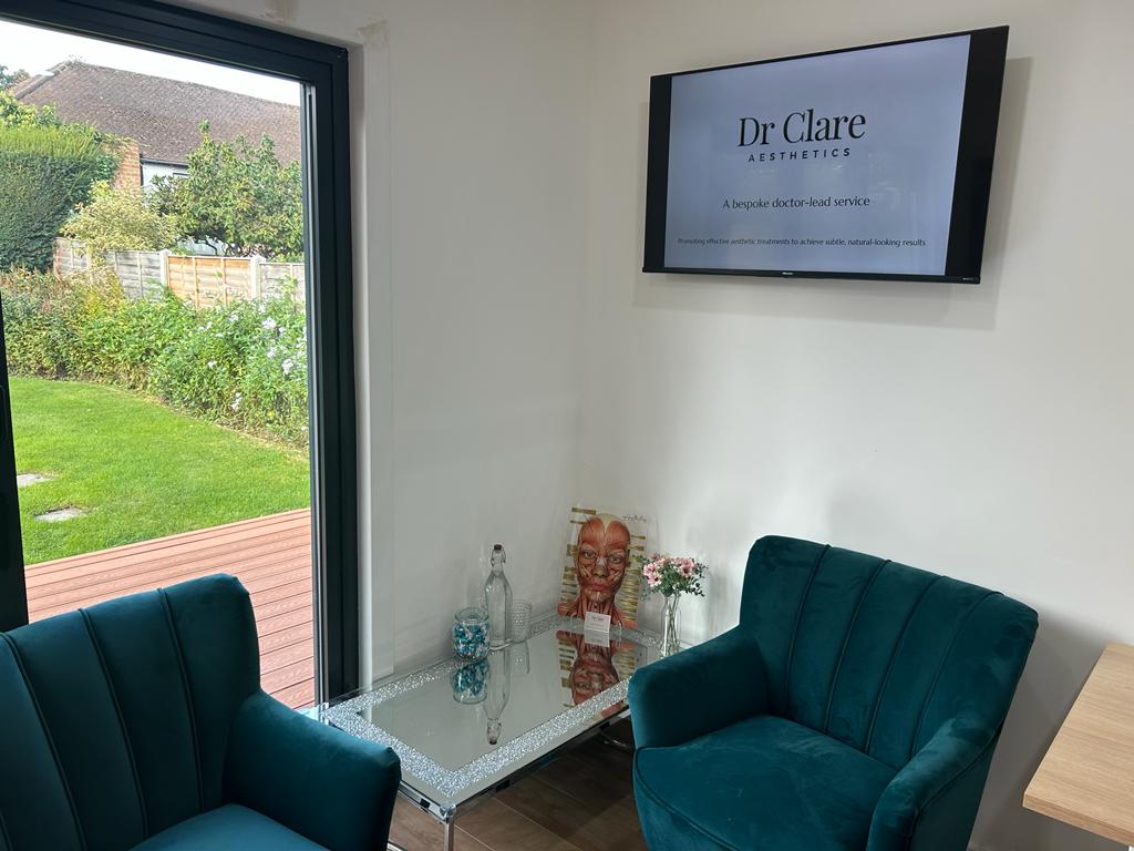 Two comfortable chairs in the clinic waiting area